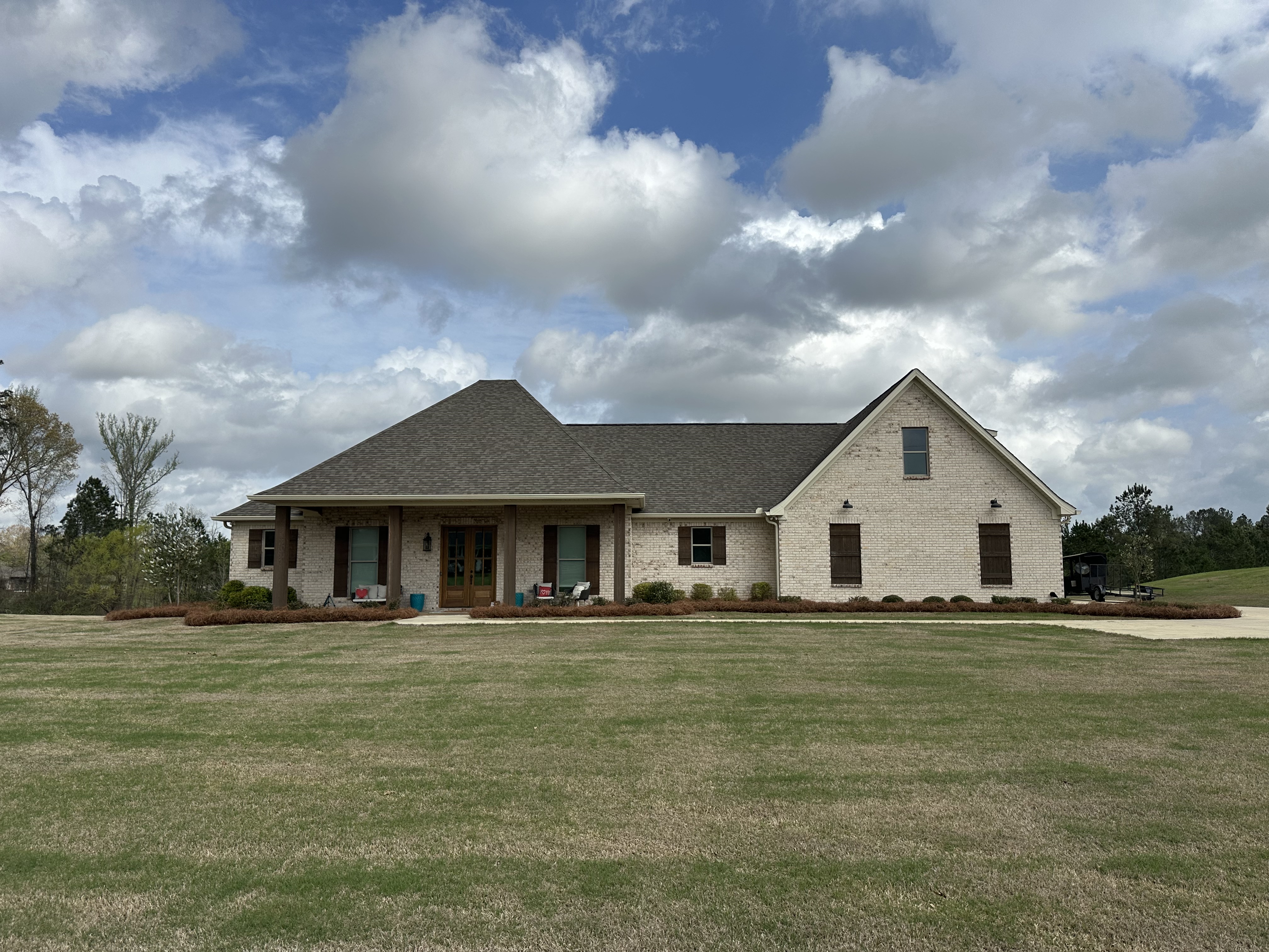 Brick home with manicured yard